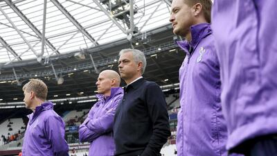 Tottenham Hotspur's Portuguese coach Jose Mourinho watches the players warm up before the start of the Premier League football match against West Ham United at The London Stadium on November 23, 2019. It was Mourinho's first match in charge after succeeding Mauricio Pochettino. Spurs won 3-2. AFP