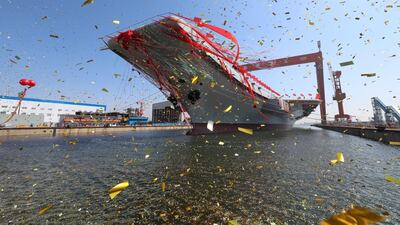 China’s newly-built aircraft carrier is launched at a shipyard in Dalian in north-eastern China. Li Gang / Xinhua via AP