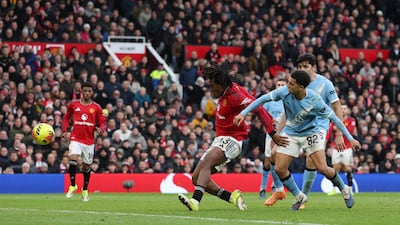 Patrick Dorgu of Manchester United scores his team's second goal against Manchester City. Getty Images