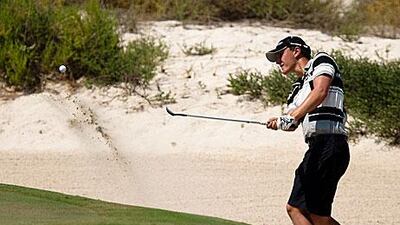 Daniel Owen wedges his way out of the bunker on the 17th hole of the first day of the Citizen Open.