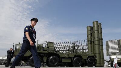 A Russian military official walks past an S-400 anti-aircraft missile system. EPA