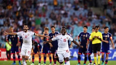 UAE players Ismail Al Hammadi, No 15, and Majed Hassan, No 17, celebrate after winning the penalty shootout against Japan in the Asian Cup quarter-finals at Stadium Australia in Sydney on January 23, 2015. Paul Miller / EPA