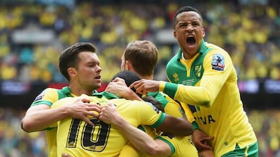 Cameron Jerome of Norwich City (10) is congratulated by Martin Olsson (23) and team mates as he scores their first goal during the Sky Bet Championship Playoff Final between Middlesbrough and Norwich City at Wembley Stadium on May 25, 2015 in London, England. (Photo by Tom Dulat/Getty Images)