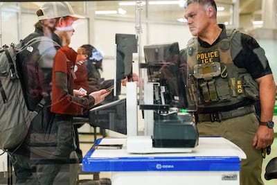 An Immigration and Customs Enforcement agent works at a Transportation Security Administration checkpoint at Hartsfield-Jackson Atlanta International Airport (ATL) in Atlanta, Georgia. Bloomberg