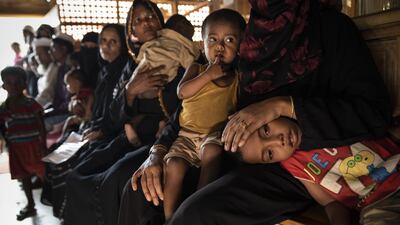 Rohingya women and children are seen waiting to be treated in Balukhali camp, Cox's Bazar, Bangladesh. Paula Bronstein / Getty