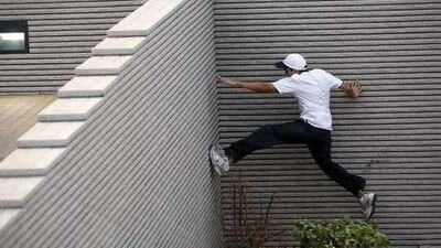 Arjun Bhuptani practices parkour tricks near the Corniche in Abu Dhabi August 15, 2008.