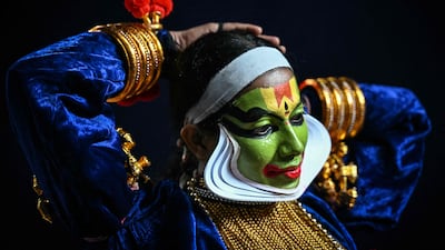 An entertainer prepares to perform Kathakali, a traditional form of classical Indian dance, at a cultural festival in Chennai. AFP