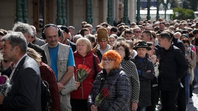 People queue outside the hall near the Kremlin. AP