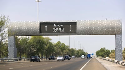 Gateway to the East: road signs between Abu Dhabi and Dubai welcome Xi Jinping, President of the People's Republic of China. Reem Mohammed / The National