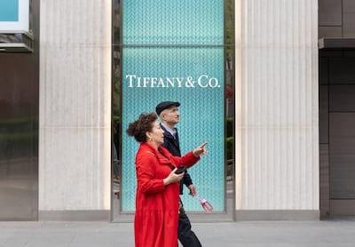 Pedestrians walk past US luxury retailer Tiffany & Co in Beijing, as China and the US battle over tariffs. EPA
