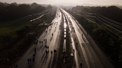 Pedestrian commuters on the Pan American Highway, which was closed by roadblocks set up by protesters demonstrating against inflation, especially surging fuel prices, in Pacora, Panama. AP Photo