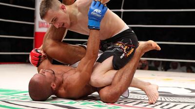 The UAE’s Ahmad Al Darmaki, in white shorts, fights with Artiyom Gorodynets from Ukraine in the Abu Dhabi Warriors 4 at IPIC Arena in Zayed Sports city in Abu Dhabi. Ravindranath K / The National