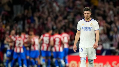 Real Madrid's Luka Jovic reacts as Atletico Madrid players celebrate Yannick Carrasco's goal. AP Photo