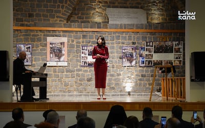Visitors attend an exhibition marking the reopening of the historic Orthodox Theatre in the Old City of Homs. Sana