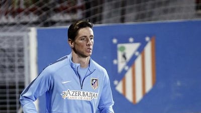 Fernando Torres jogs during Atletico Madrid's team training session on Tuesday. Fernando Alvarado / EPA