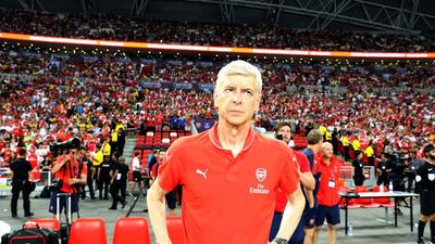 Arsene Wenger looks on after winning the Barclays Asia Trophy pre-season tournament final against Everton on Saturday in Singapore. Lionel Ng / Getty Images / July 18, 2015