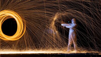 A long-exposure image released by Roy Wang depicts a medical worker. The Beijing-based artist has paid tribute to doctors and nurses and their months-long battle to treat virus-stricken patients in his latest light painting creations. AFP