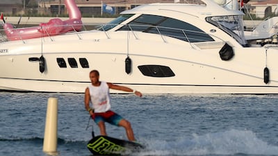 People compete in the flyboard section of the Dubai Watersports Summer Week.