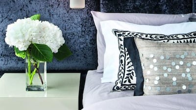 Velveteen panels ensure the bedroom is extra peaceful and Droog’s Milk Bottle lamps add a fun touch. Courtesy Home Journal/Edgar Tapan; styling by Bridget Snelgar