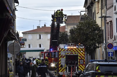 Firefighters at a building in Saint Laurent de la Salaque where an explosion and fire occurred in the early hours of Monday. AFP