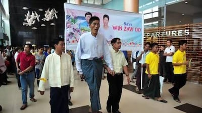 Win Zaw Oo (centre) At Yangon’s international airport where he prepares to department for treatment in Singapore.
