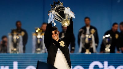 Manchester City's Phil Foden with the Premier League trophy. PA