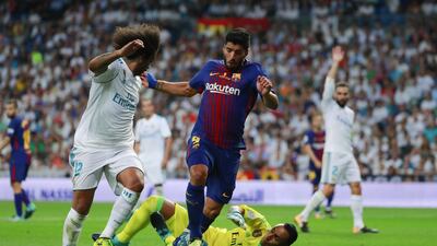 Bareclona's Luis Suarez clashes with Real Madrid's Keylor Navas. Gonzalo Arroyo Moreno / Getty Images