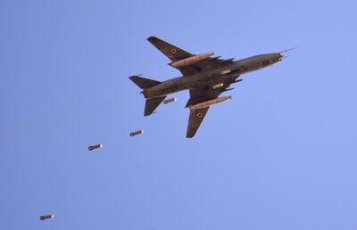 A Sukhoi Su-22 Syrian army plane releases bombs over southern Damascus in the area of Yarmouk Palestinian refugee camp on April 24, 2018. AFP Photo
