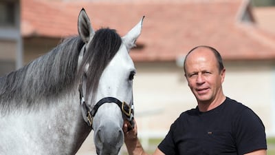 Ernst Oertel with AF Al Sajanjle, who will race in the Dubai Kahayla Classic on Dubai World Cup night. Erika Rasmussen for The National