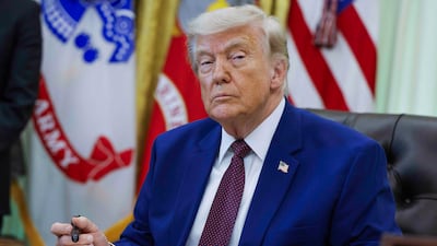 President Donald Trump signs an executive in the White House. EPA / Bloomberg