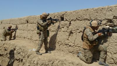 Afghan security forces take position during a battle with the Taliban in Kunduz province, Afghanistan. Reuters
