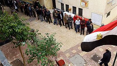 Egyptian men queue up to vote in Cairo yesterday. The first parliamentary elections since the fall of Hosni Murbarak continue for a second day in the country.