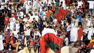 Oman fans cheer their team during the 2014 World Cup qualifying match against Jordan in Muscat.
