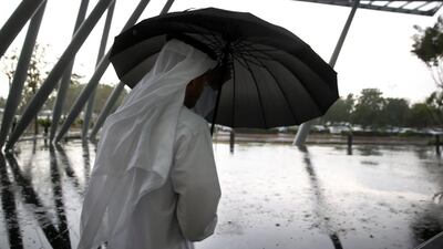 The sky above the capital turned dark at noon on Tuesday as heavy rain fell across the emirate. Delores Johnson / The National