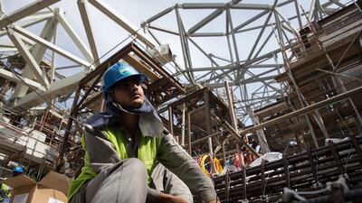 A man works on the cathodic protection system at Louvre Abu Dhabi in March 2014. Silvia Razgova / The National