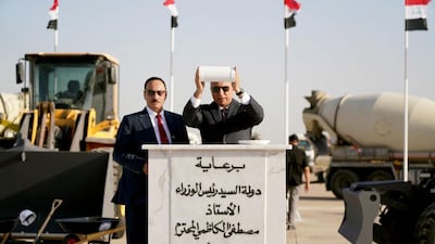 Iraqi Prime Minister Mustafa Al Kadhimi, right, during the ceremony to lay the foundation stone of the Mosul International Airport rehabilitation project, on Wednesday. AFP