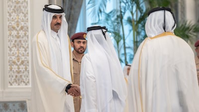 Qatar's Emir Sheikh Tamim shakes hands with a mourner at Lusail Palace in Doha. Reuters