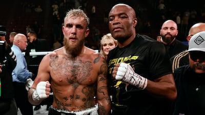 Jake Paul and Anderson Silva pose together following their fight at the Desert Diamond Arena in Glendale, Arizona. EPA