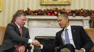 King Abdullah of Jordan and US president Barack Obama shake hands at the Oval Office on December 5, 2014. Larry Downing / Reuters