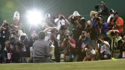 Rory McIlroy poses for photos with the Claret Jug after winning the British Open on Sunday at Royal Liverpool in Hoylake, England. Toby Melville / Reuters