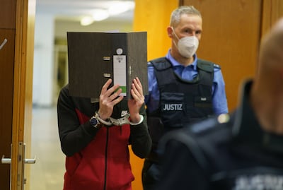 Taha Al Jumailly, who covered his face throughout his trial, was found guilty at a court in Frankfurt of genocide. EPA