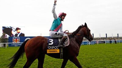 Tom Quealy celebrates on Frankel after bringing him home for his 14th consecutive win. Pic: Eddie Keogh/Reuters