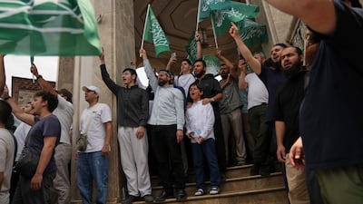 Demonstrators chanting outside Taksim Mosque in Istanbul. AP