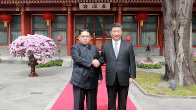 North Korean leader Kim Jong Un shakes hands with Chinese President Xi Jinping, as he paid an unofficial visit to Beijing, China. KCNA / via Reuters