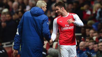 Arsene Wenger, left, manager of Arsenal shakes hands with Olivier Giroud during their FA Cup fifth round match against Middlesbrough at Emirates Stadium on February 15, 2015 in London, England. (Photo by Jamie McDonald/Getty Images)