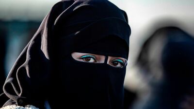 A Syrian woman waits to leave the Kurdish-run al-Hol camp holding relatives of alleged Islamic State (IS) group fighters, in the al-Hasakeh governorate in northeastern Syria. A Kurdish official in charge of the region's camps said 515 people from 120 families were returning to areas in the east of Deir Ezzor province, the first to do so after the Kurdish authorities in northeast Syria vowed to allow thousands of Syrians including the families of IS fighters out of the over-populated camp. AFP