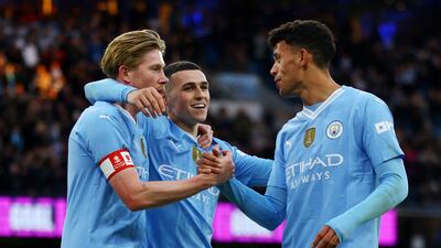 Soccer Football - FA Cup - Third Round - Manchester City v Huddersfield Town - Etihad Stadium, Manchester, Britain - January 7, 2024 Manchester City's Kevin De Bruyne, Phil Foden and Matheus Nunes celebrates their fifth goal, scored by Jeremy Doku Action Images via Reuters / Lee Smith