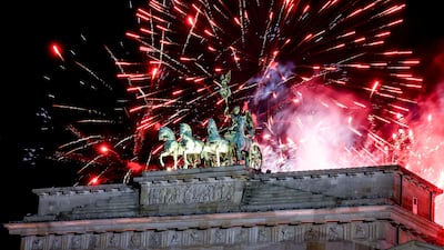 Fireworks illuminate the sky over the Quadriga statue of the Brandenburg Gate during New Year's Eve celebrations in Berlin, Germany. EPA