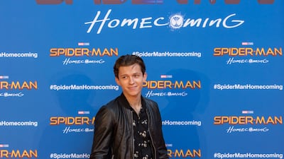 Tom Holland, in a black flower-patterned shirt and leather jacket, attend the 'Spider-Man: Homecoming; premiere in Barcelona on June 18, 2017. Getty Images