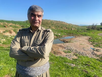 Karim Parvizi, a commander in the Democratic Party of Iranian Kurdistan, poses outside a base belonging to the group in the Iraqi Kurdish town of Koya, on March 18. Lizzie Porter / The National